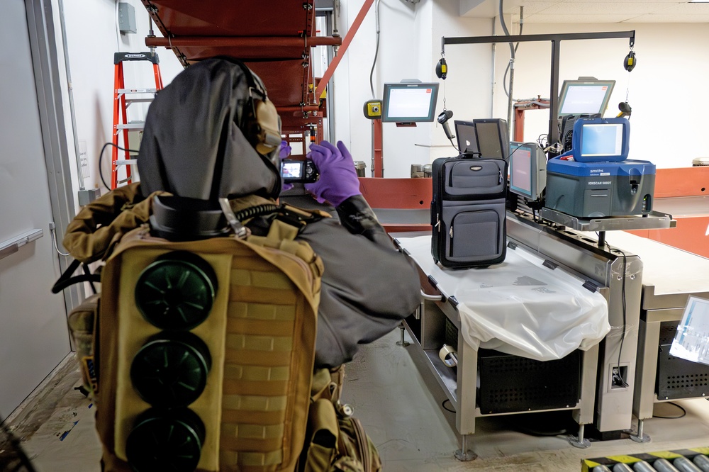 An EOD Technician Assesses an Improvised Explosive Device During a Drill at the Guam Airport