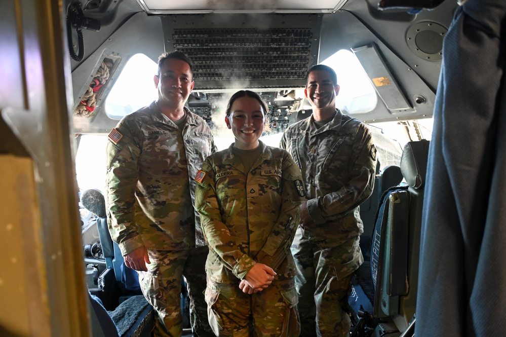 Pfc stands with command in C-17 cockpit