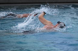 A competitor in the 2024 U.S. Army Special Operations Command (USASOC) Best Combat Diver Competition participates in a swimming race