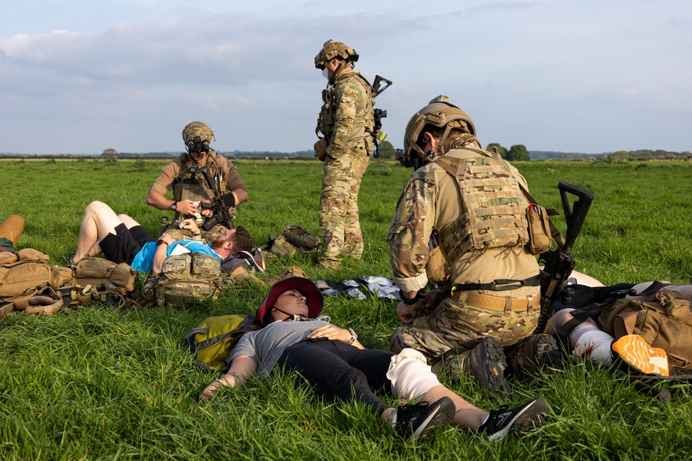 U.S. Army Green Berets, U.S. Navy SEALs and U.S. Air Force Special Tactics perform civilian recovery operations training during joint multilateral training