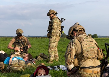 U.S. Army Green Berets, U.S. Navy SEALs and U.S. Air Force Special Tactics perform civilian recovery operations training during joint multilateral training