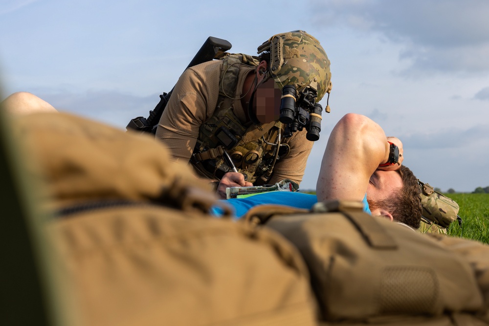 U.S. Army Green Berets, U.S. Navy SEALs and U.S. Air Force Special Tactics practice civilian recovery operations during joint multilateral training
