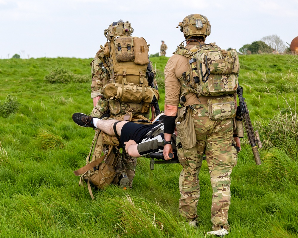 U.S. Army Green Berets, U.S. Navy SEALs and U.S. Air Force Special Tactics practice civilian recovery operations during joint multilateral training