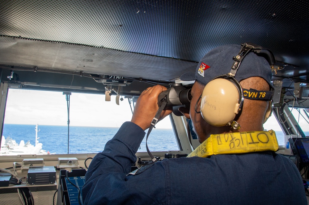 USS Ronald Reagan (CVN 76) Sailors stand watch  in the pilot house