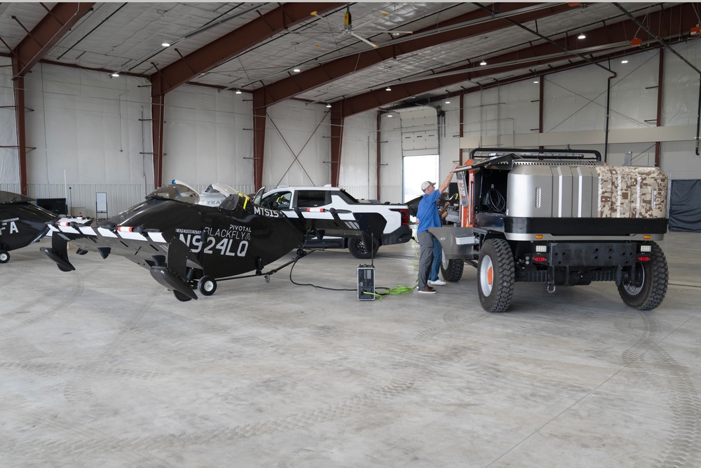 AFWERX - Pivotal's BlackFly being recharged by a DANNAR Mobile Charging Vehicle