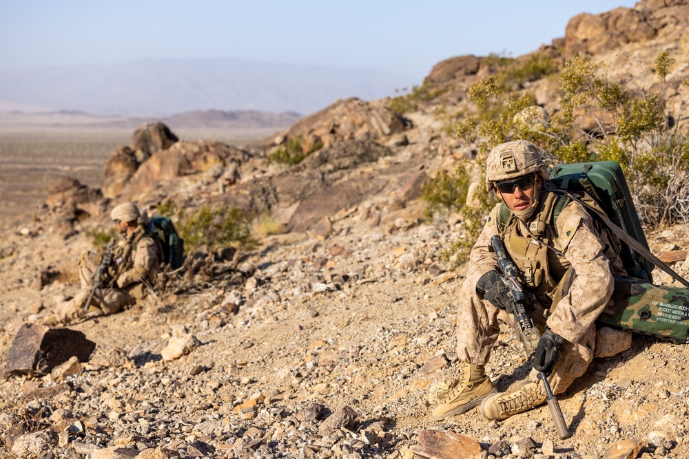 U.S. Marine with 2nd Battalion, 24th Marine Regiment, execute range 400