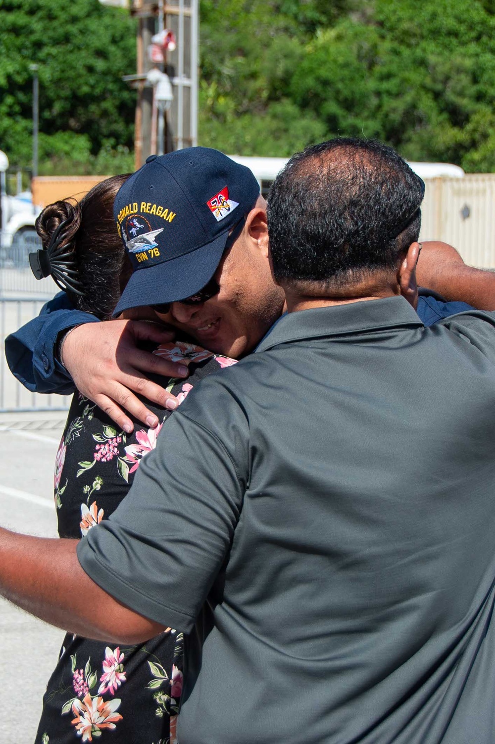 USS Ronald Reagan (CVN 76) Sailors greet family on the pier after arriving at Naval Base Guam for scheduled port visit