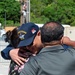 USS Ronald Reagan (CVN 76) Sailors greet family on the pier after arriving at Naval Base Guam for scheduled port visit