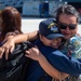 USS Ronald Reagan (CVN 76) Sailors greet family on the pier after arriving at Naval Base Guam for scheduled port visit