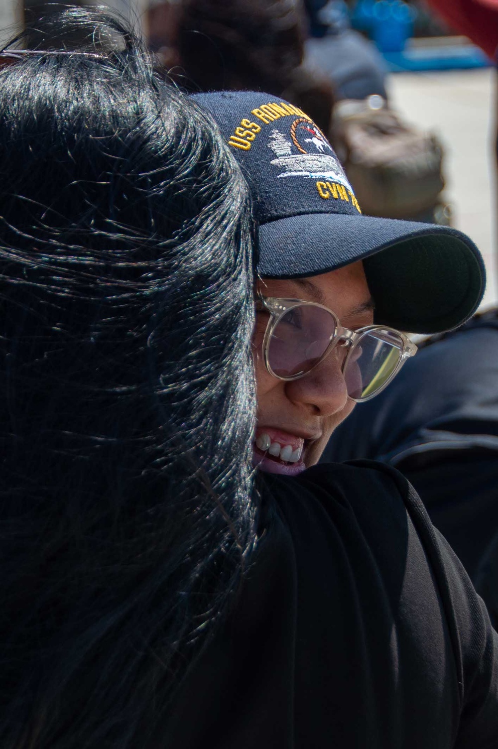 USS Ronald Reagan (CVN 76) Sailors greet family on the pier after arriving at Naval Base Guam for scheduled port visit