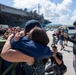 USS Ronald Reagan (CVN 76) Sailors greet family on the pier after arriving at Naval Base Guam for scheduled port visit