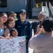 USS Ronald Reagan (CVN 76) Sailors greet family on the pier after arriving at Naval Base Guam for scheduled port visit