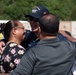USS Ronald Reagan (CVN 76) Sailors greet family on the pier after arriving at Naval Base Guam for scheduled port visit
