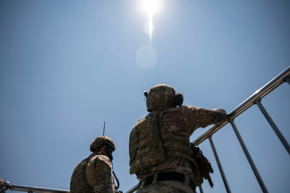 U.S. Special Operations personnel conduct live fire training with AC-130J gunship