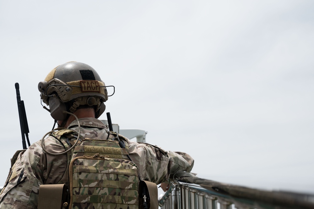 U.S. special operations personnel conduct routine live fire training with AC-130J gunship