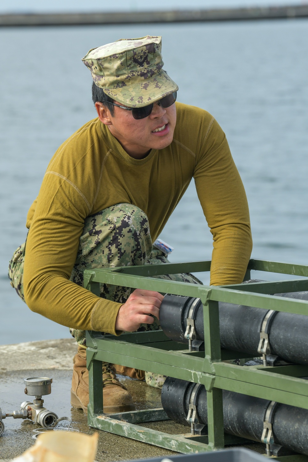 NMCB 11 teaches Latvian Engineers about Water Purification during BALTOPS 24