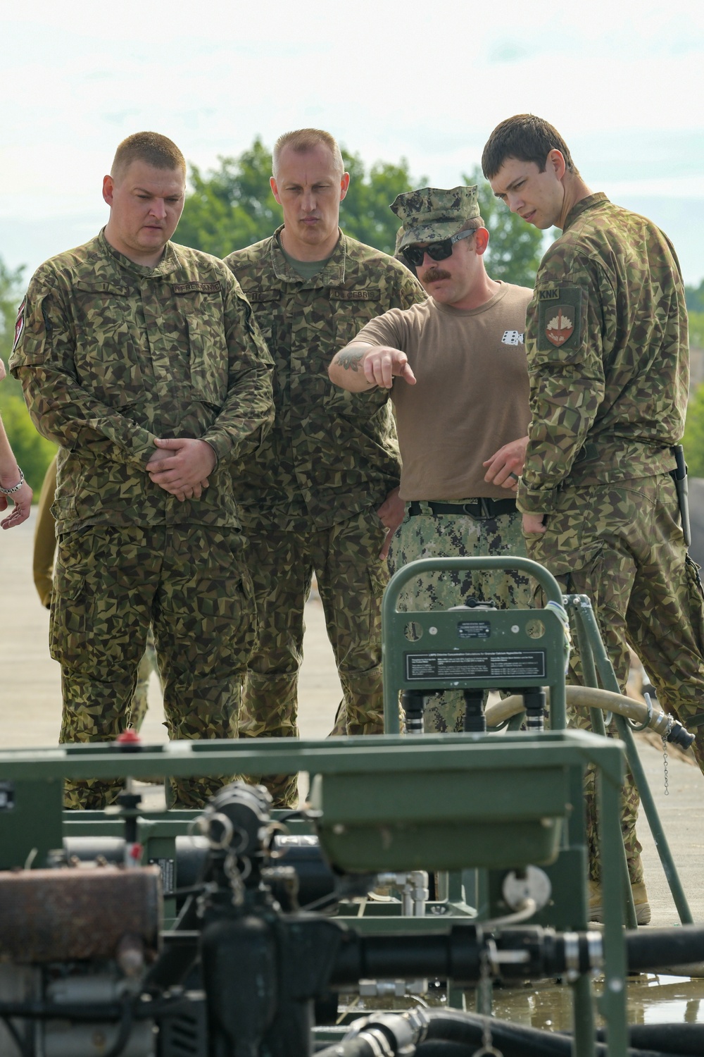 NMCB 11 teaches Latvian Engineers about Water Purification during BALTOPS 24