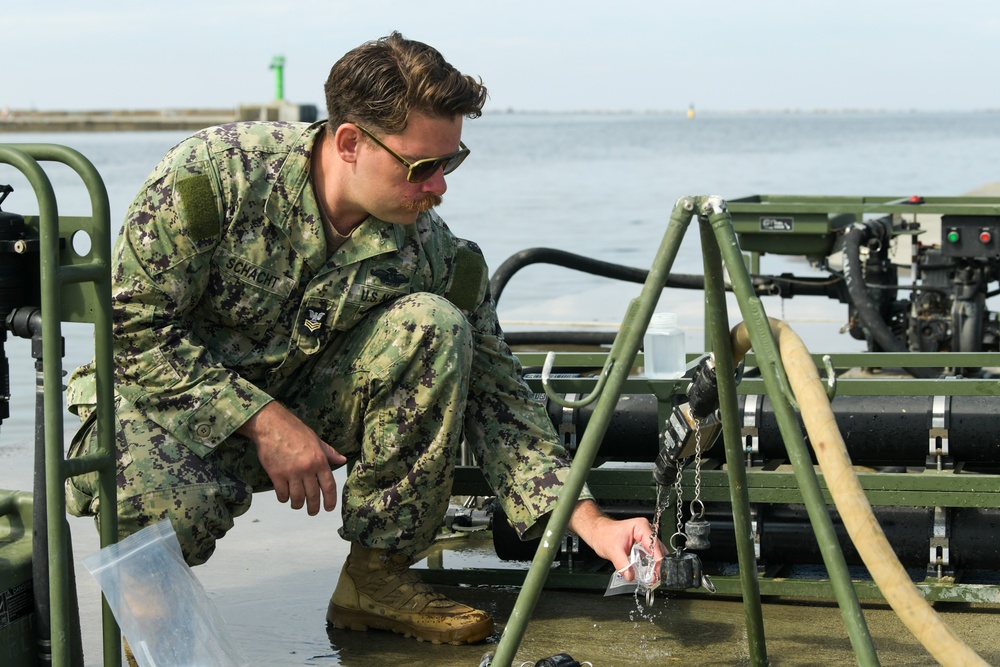 NMCB 11 teaches Latvian Engineers about Water Purification during BALTOPS 24