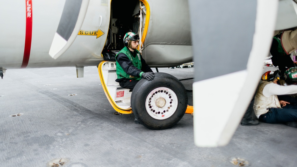 Sailors Change an E-2C Tire