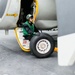 Sailors Change an E-2C Tire