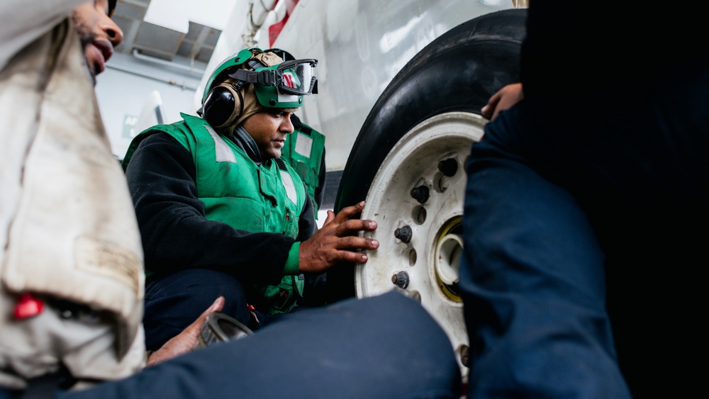 Sailors Change an E-2C Tire