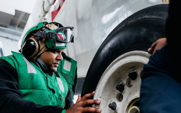 Sailors Change an E-2C Tire