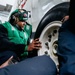 Sailors Change an E-2C Tire