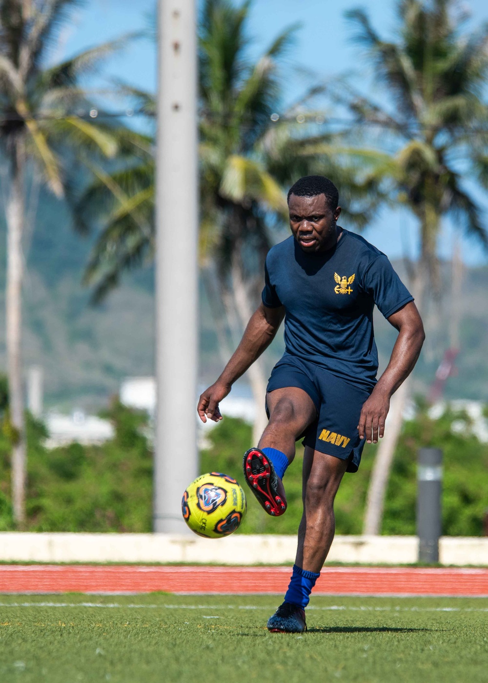 USS Ronald Reagan (CVN 76) Sailors play soccer in Guam