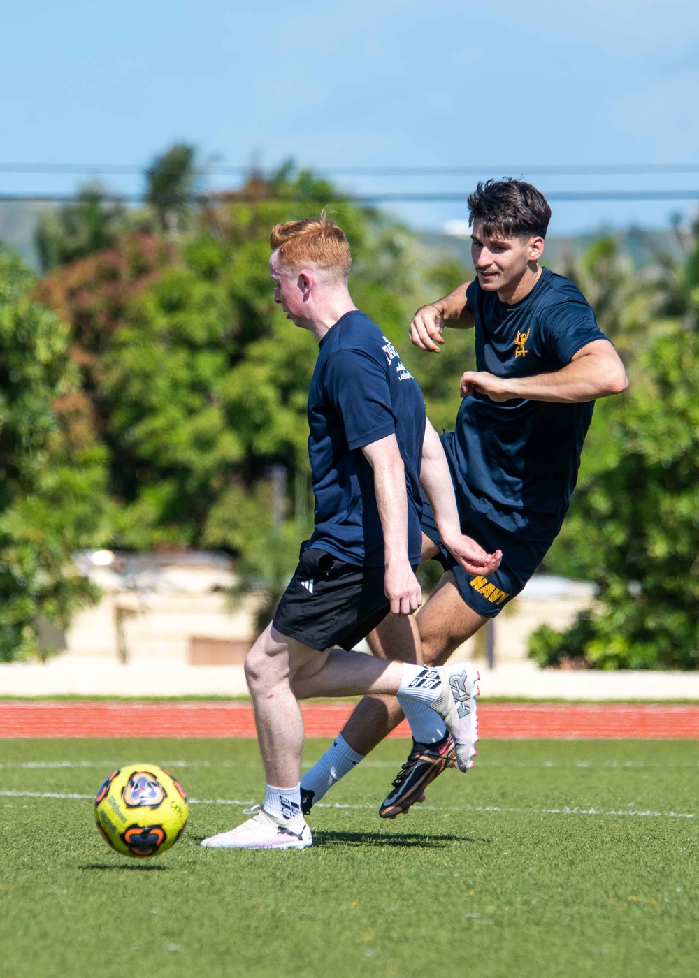 USS Ronald Reagan (CVN 76) Sailors play soccer in Guam