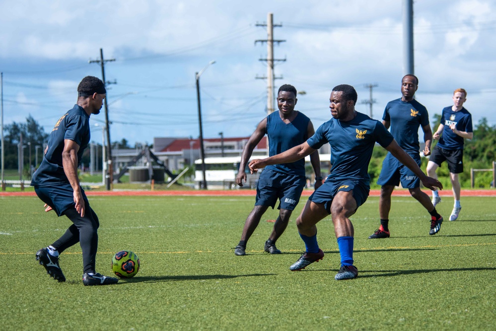 USS Ronald Reagan (CVN 76) Sailors play soccer in Guam