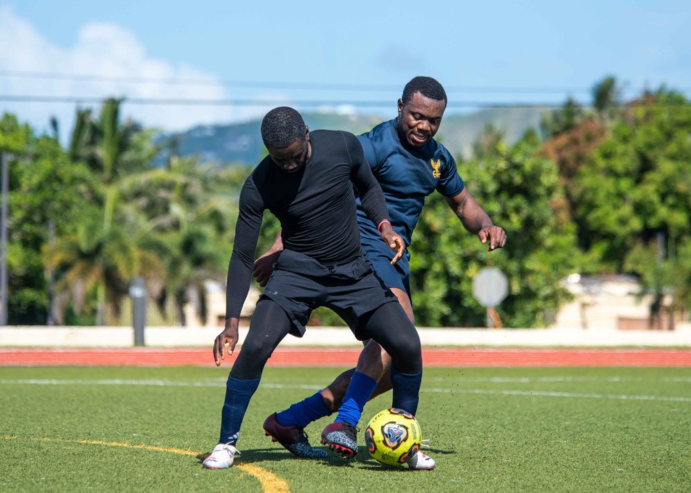 USS Ronald Reagan (CVN 76) Sailors play soccer in Guam