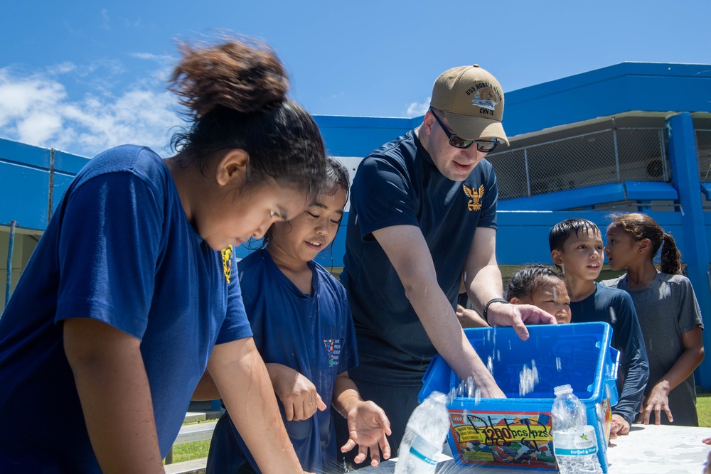 USS Ronald Reagan (CVN 76) Sailors and other Navy Sailors participate in a community relations event at Manuel Ulloa Lujan Elementary School