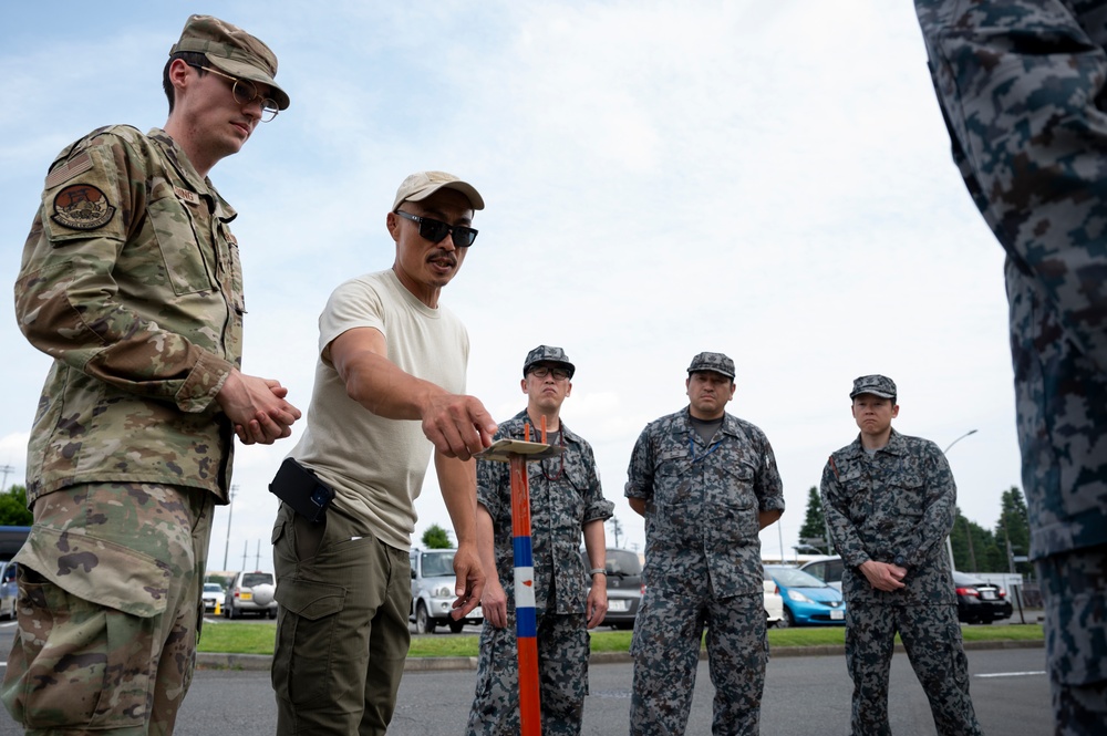 374th CES, Japan forces hone interoperability during CBRN training