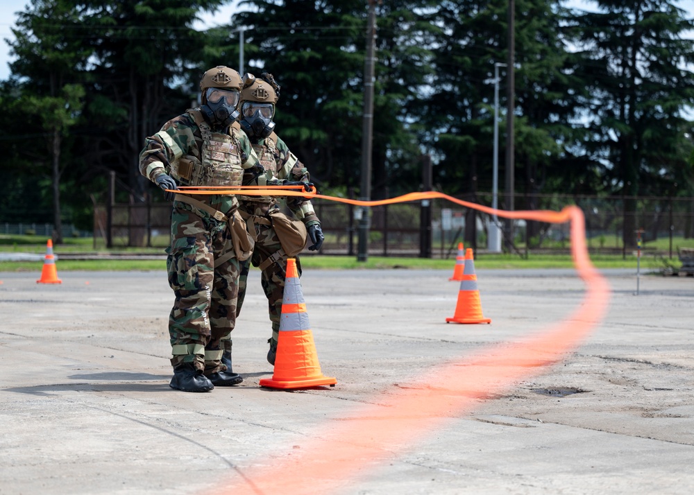 374th CES, Japan forces hone interoperability during CBRN training