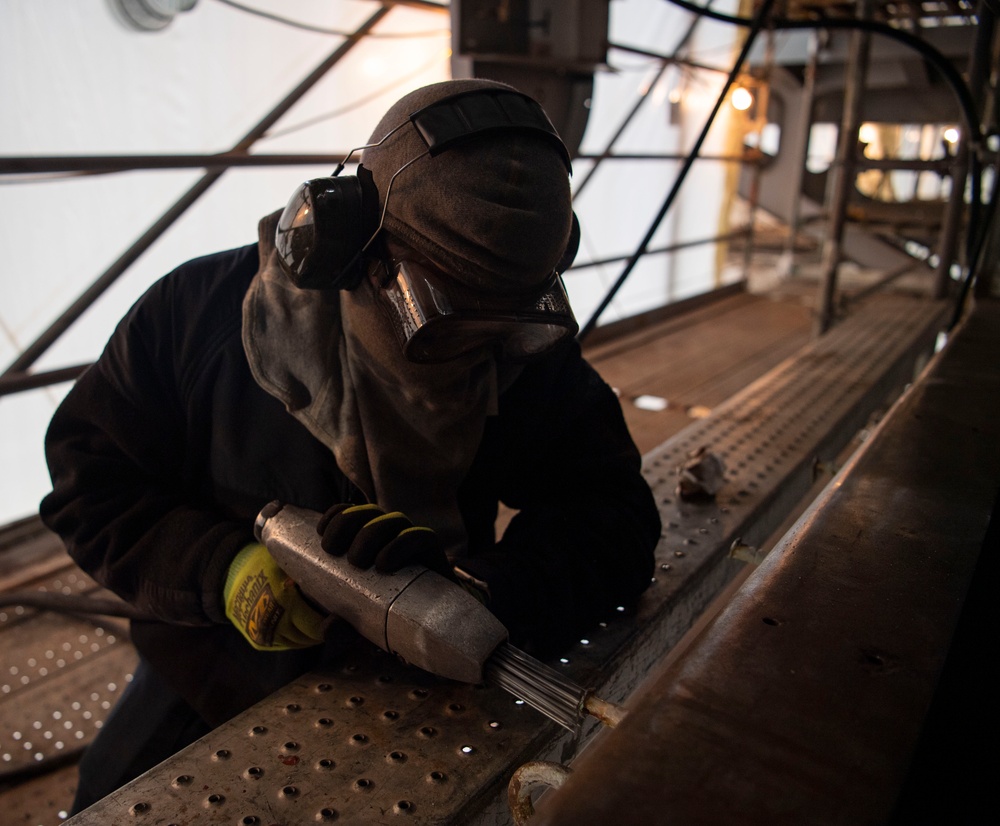 Sailor Conducts Corrosion Control