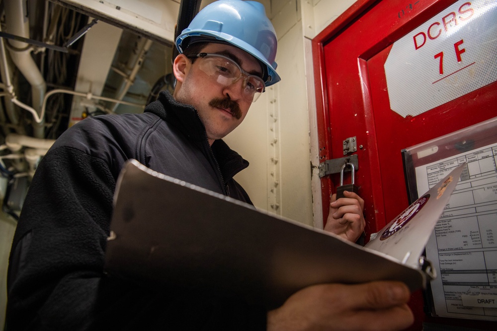 Sailor Checks Repair Lockers