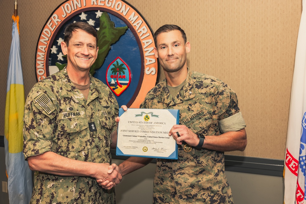Rear Adm. Greg Huffman Awards Lt. Col. Winkofsky for Outstanding Service