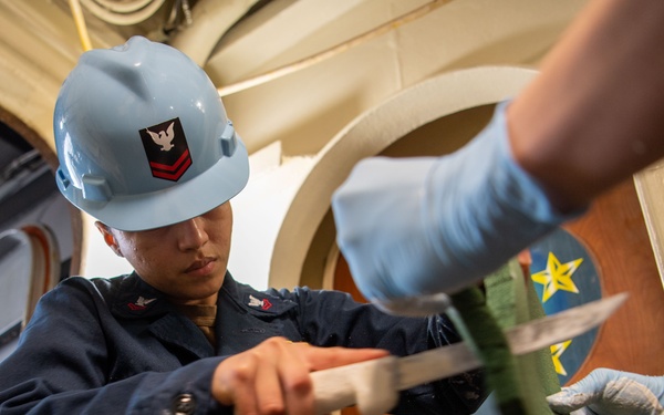 Sailor Prepares For Lagging