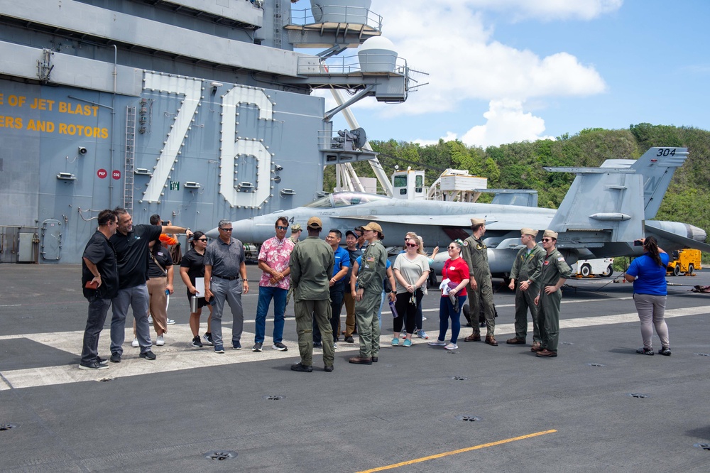 USS Ronald Reagan (CVN 76) hosts ship tour for United Services Organization representatives and Naval Mobile Construction Battalion 11