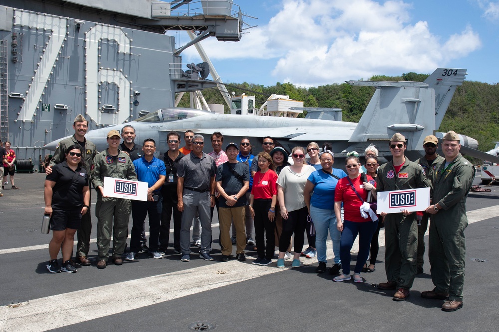 USS Ronald Reagan (CVN 76) hosts ship tour for United Services Organization representatives and Naval Mobile Construction Battalion 11