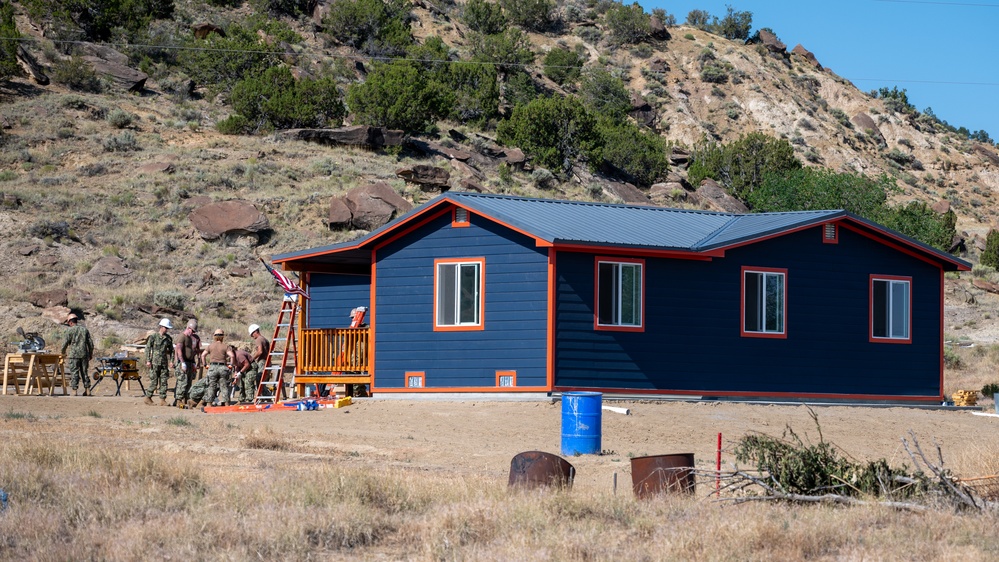 U.S. Navy Seabees put the finishing touches on a new home.