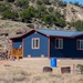 U.S. Navy Seabees put the finishing touches on a new home.