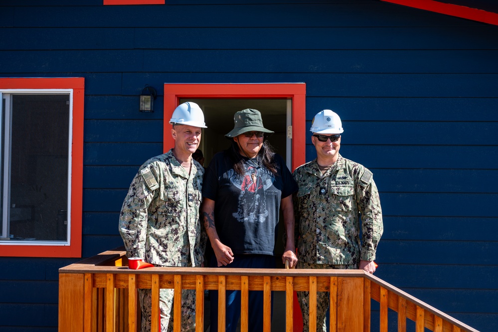 Alvin Malone poses with Navy Officers