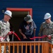 Alvin Malone cuts the ribbon on his new home.