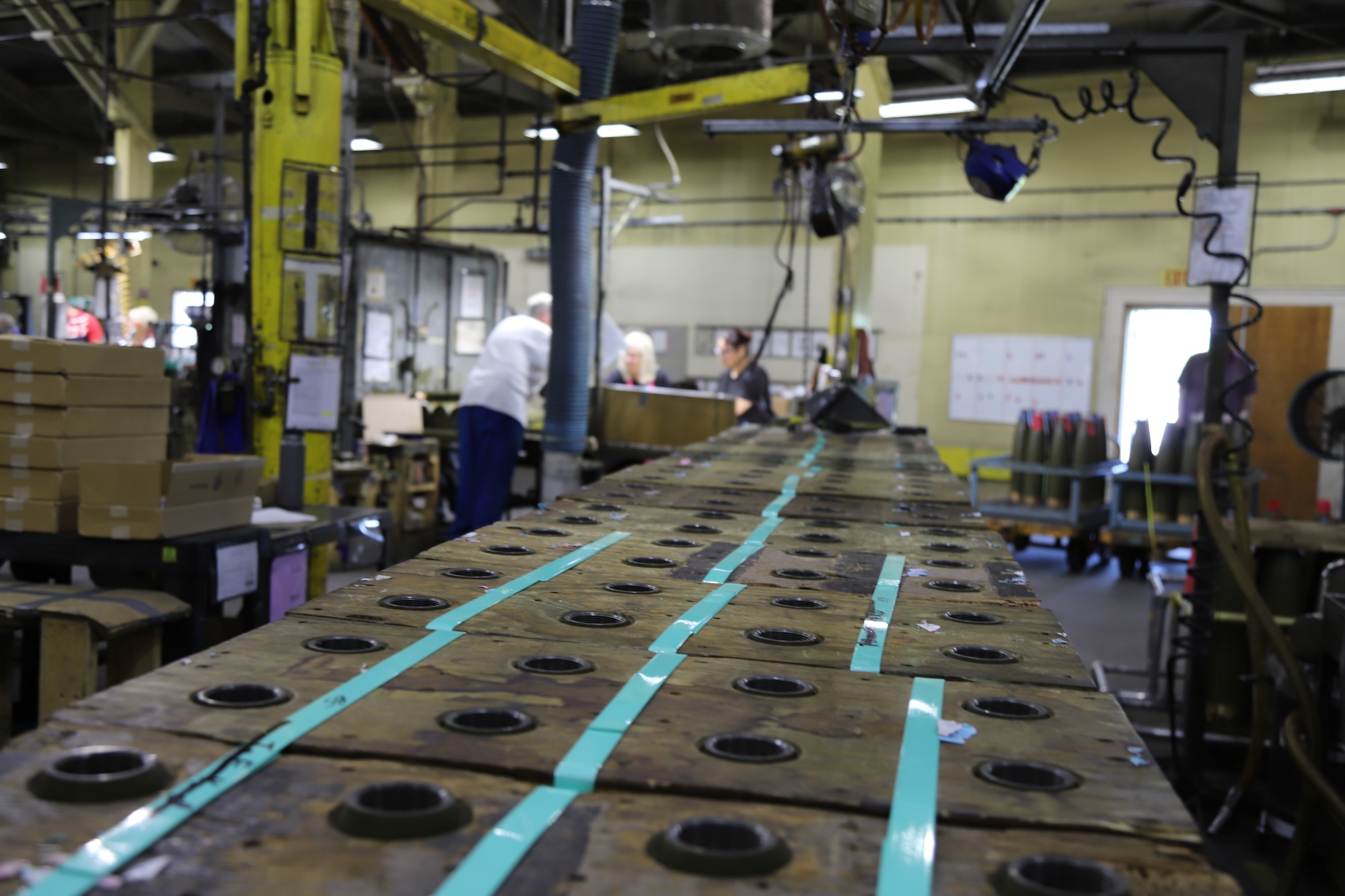 155mm artillery projectiles on an automated production line at a US Army ammunition plant