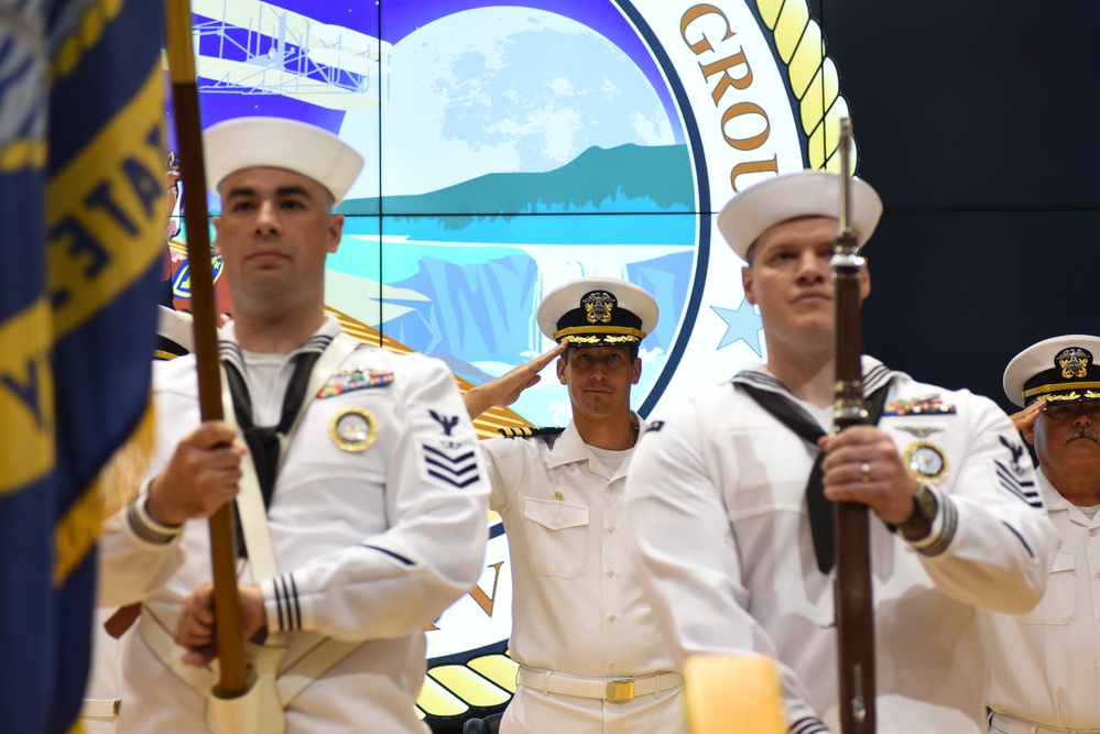 Cmdr. Moss Salutes During National Anthem