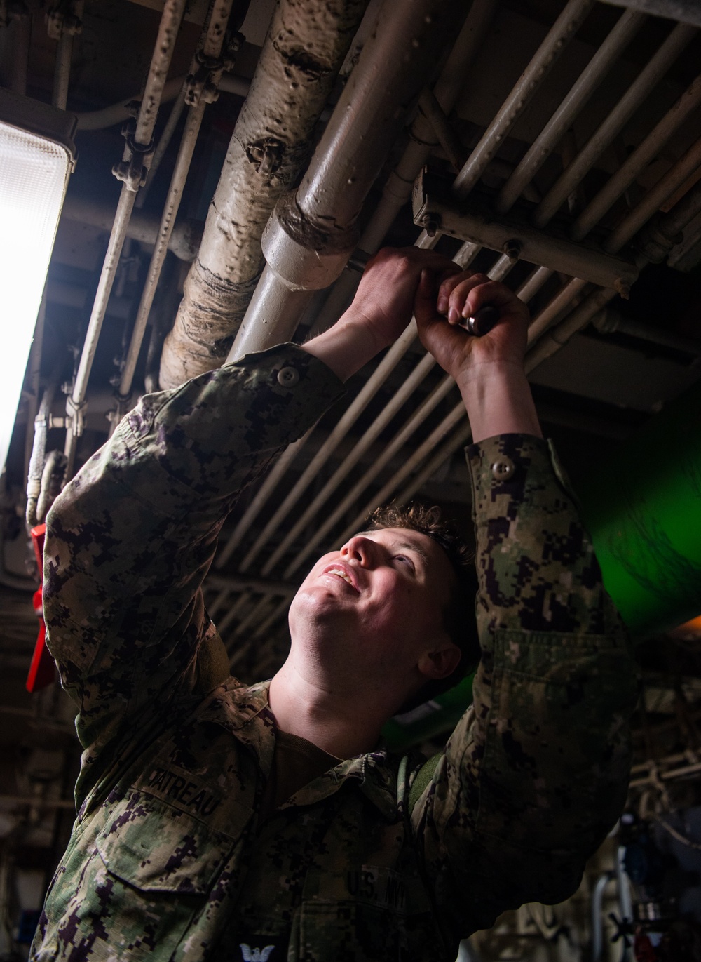 Sailor Conducts Maintenance