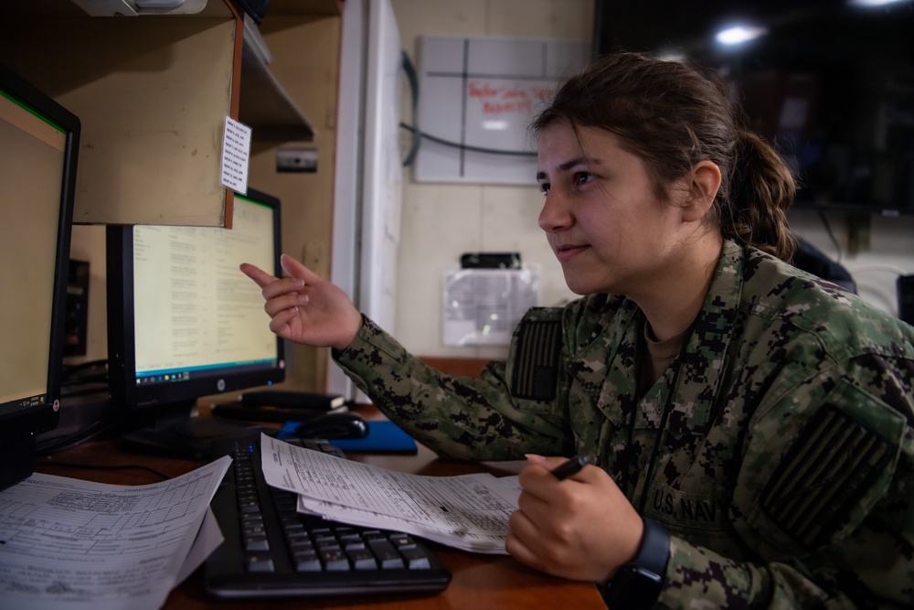 Sailor Fills out Paperwork