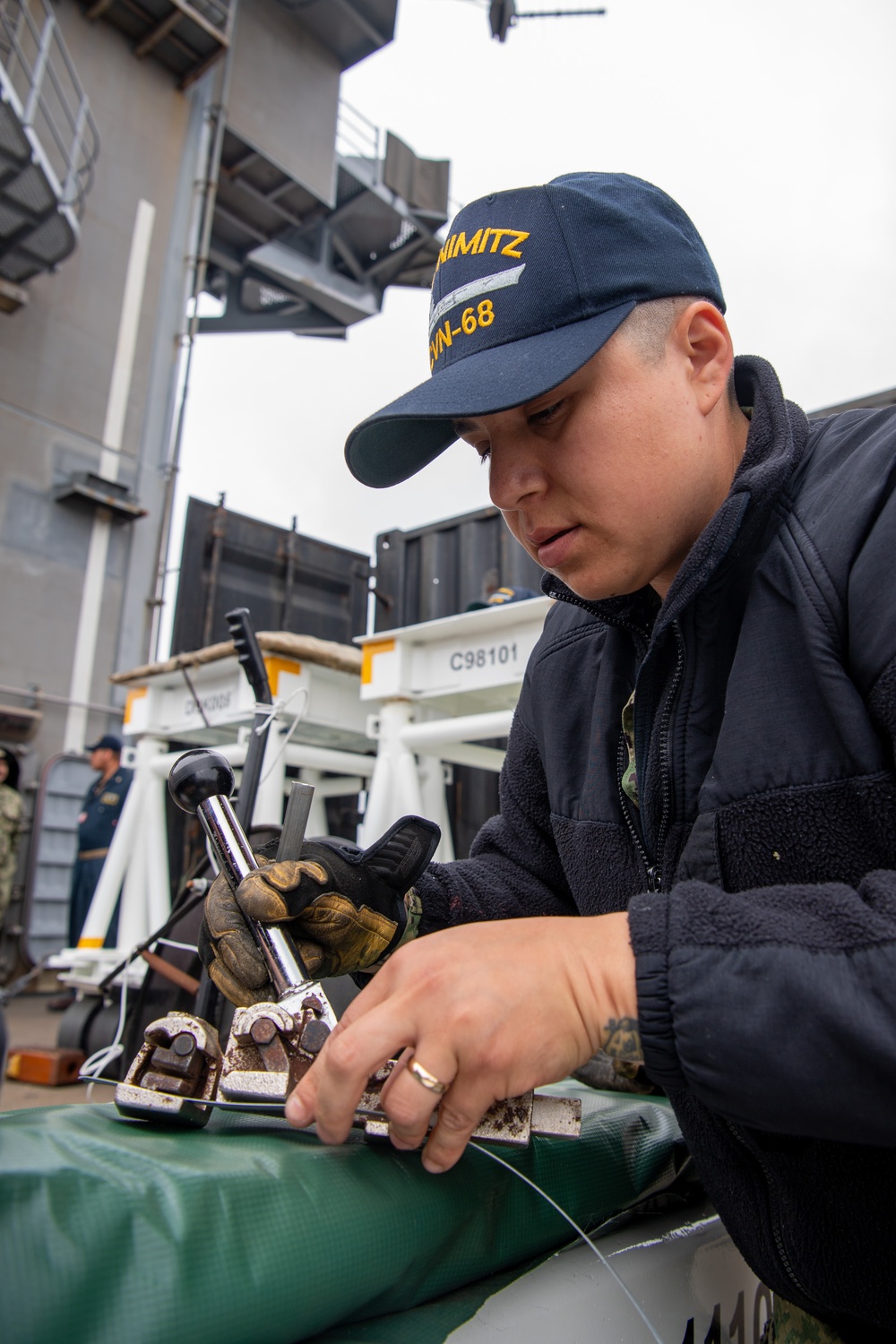 Sailor Performs Maintenance