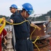 Sailors aboard the USS Howard conduct a sea and anchor detail in Yokosuka, Japan